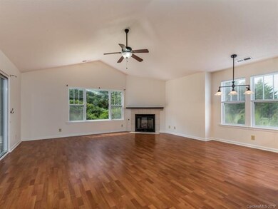 A gas log fireplace warms the open concept living 