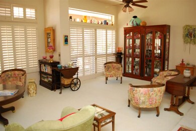 Great Room / shutters opening to patio