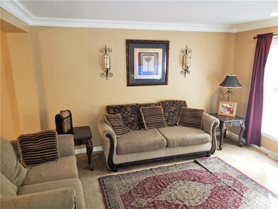 Another view of the living room from the stairs to