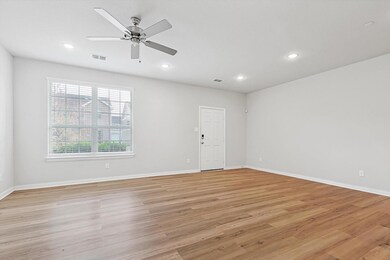 Spare room featuring ceiling fan and light wood-type flooring
