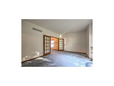 Living room with French doors to formal dining roo