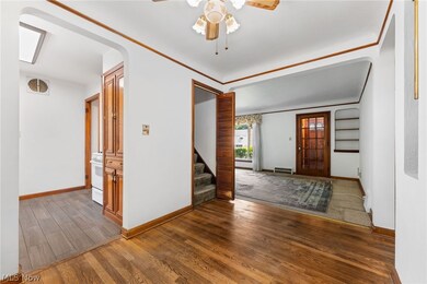 Dining room with ceiling fan and dark hardwood / wood-style flooring