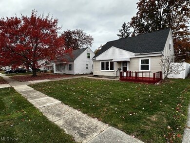 View of front of property with a front lawn and a deck