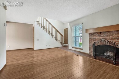 Living room with wood-burning fireplace.