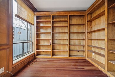 Home Office surrounded by Wall-to Ceiling Bookcase