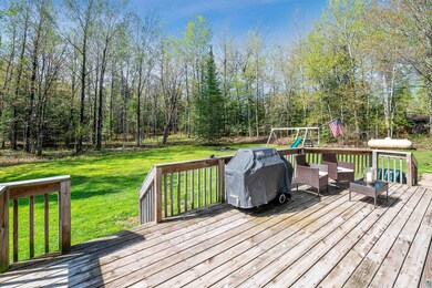 Wooden terrace with grilling area, a playground, a