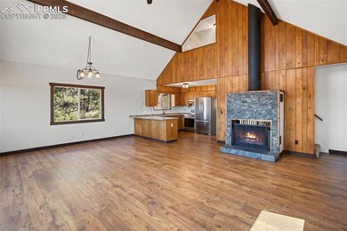 Unfurnished living room featuring high vaulted cei