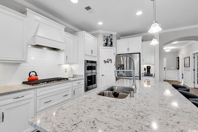 Kitchen featuring sink, stainless steel appliances