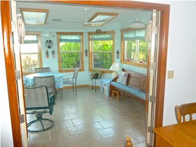 Inviting sunroom is adjacent to the kitchen and di