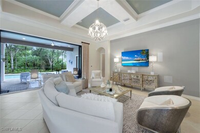 Living room featuring arched walkways, tile patter