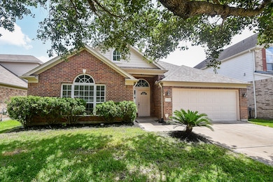 Charming single-story brick home featuring a two-c