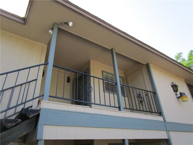 View of side of property featuring a balcony