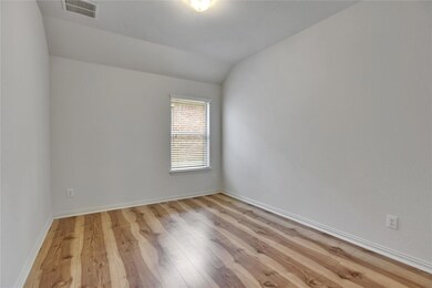 Spare room featuring light wood-style flooring an