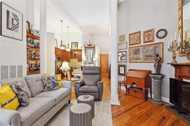 What a beautiful  and inviting unit - this wide open STUDIO is designed to create separate, lovely spaces for different uses. Here is the living room.