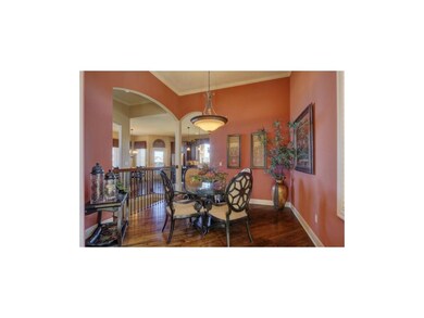 Dining area with arched openings.