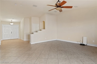 Living room featuring light tile patterned floors and a ceiling​​‌​​​​‌​​‌‌​​​‌​‌​​​‌‌​​​‌‌​​​​​​‌‌​‌‌‌ fan
