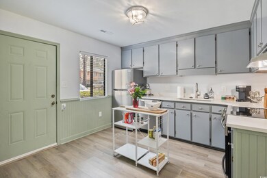 Kitchen featuring stainless steel appliances, ligh