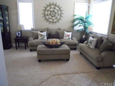 Living Room area with all cased in windows and upg