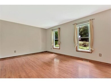 Family room with wood floors and a coat closet.