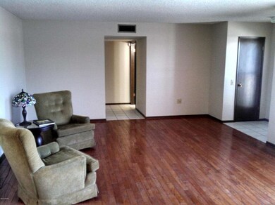 LIVING AND FORMAL DINING LOOKING TO BEDR