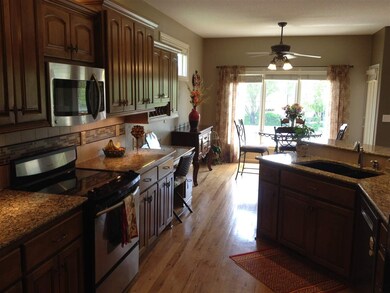 Custom maple cabinetry with solid hickory floors, 