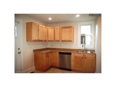 Ceramic floors in kitchen with stainless steel app