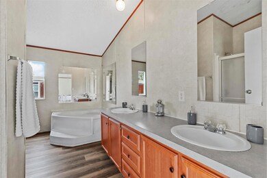 Bathroom with vanity, wood-type flooring, crown mo