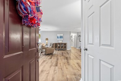 Entrance foyer with light wood-type flooring