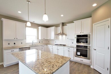 This kitchen is filled with many cabinets, a large