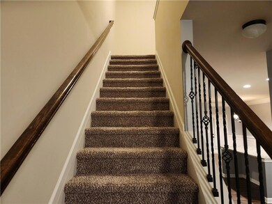 Staircase featuring baseboards and recessed lighting