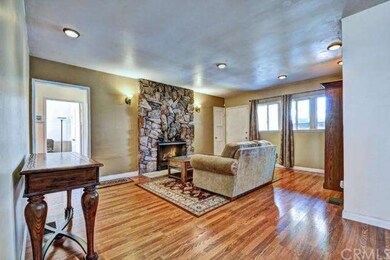 Warm Living Room With  Large Stone Wood / Gas Burn