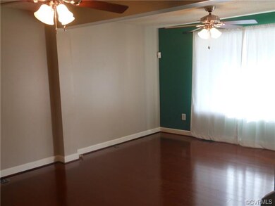 Living Room with Wood Flooring and 2 ceiling fans