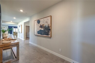 Hallway with recessed lighting and light tile patterned floors