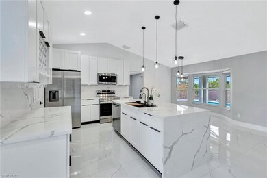 Kitchen featuring stainless steel appliances, whit