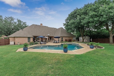 Imagine a backyard with a patio, outdoor kitchen, pool and room to play.