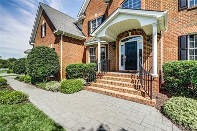 Beautifully maintained landscaping along front wal