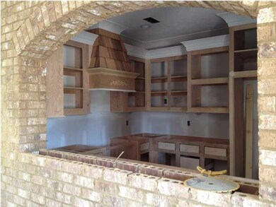 Lots of Custom Built Cabinets in Kitchen