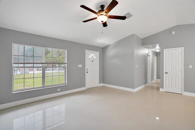 Living Room with Vaulted Ceiling and Beautiful Til
