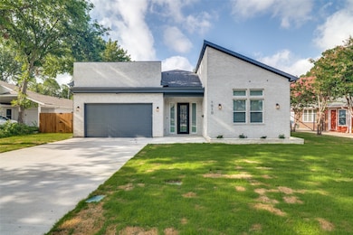 View of front facade with brick siding, concrete driveway, a garage, and a porch