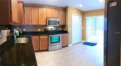 VIEW FROM HALL WAY OPEN KITCHEN STAINLESS STEEL AP