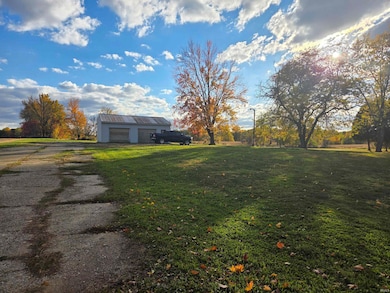 24' x 32' pole barn with two overhead doors and one service door.  Has 200 amp service, is heated and insulated.