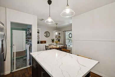Kitchen featuring light stone countertops, a kitch