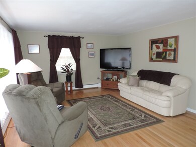 Spacious living room with hardwood floors