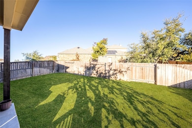 View of fenced backyard