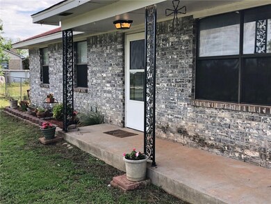 Covered front porch to relax on.