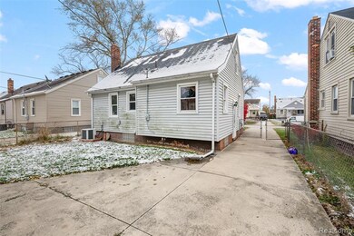 Rear view of house with a residential view, a chimney, and a gate