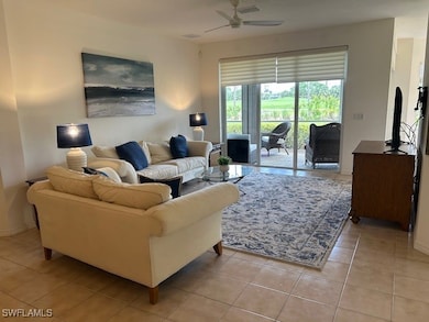 Living area with baseboards, ceiling fan, and ligh