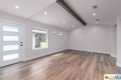 Original Cedar Beam in vaulted ceiling was preserv