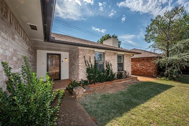 Doorway to property with a yard