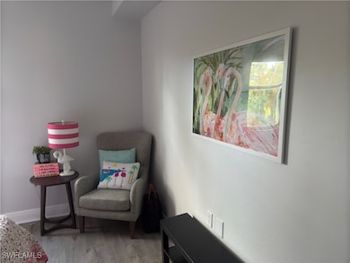 Sitting room featuring wood finished floors and baseboards